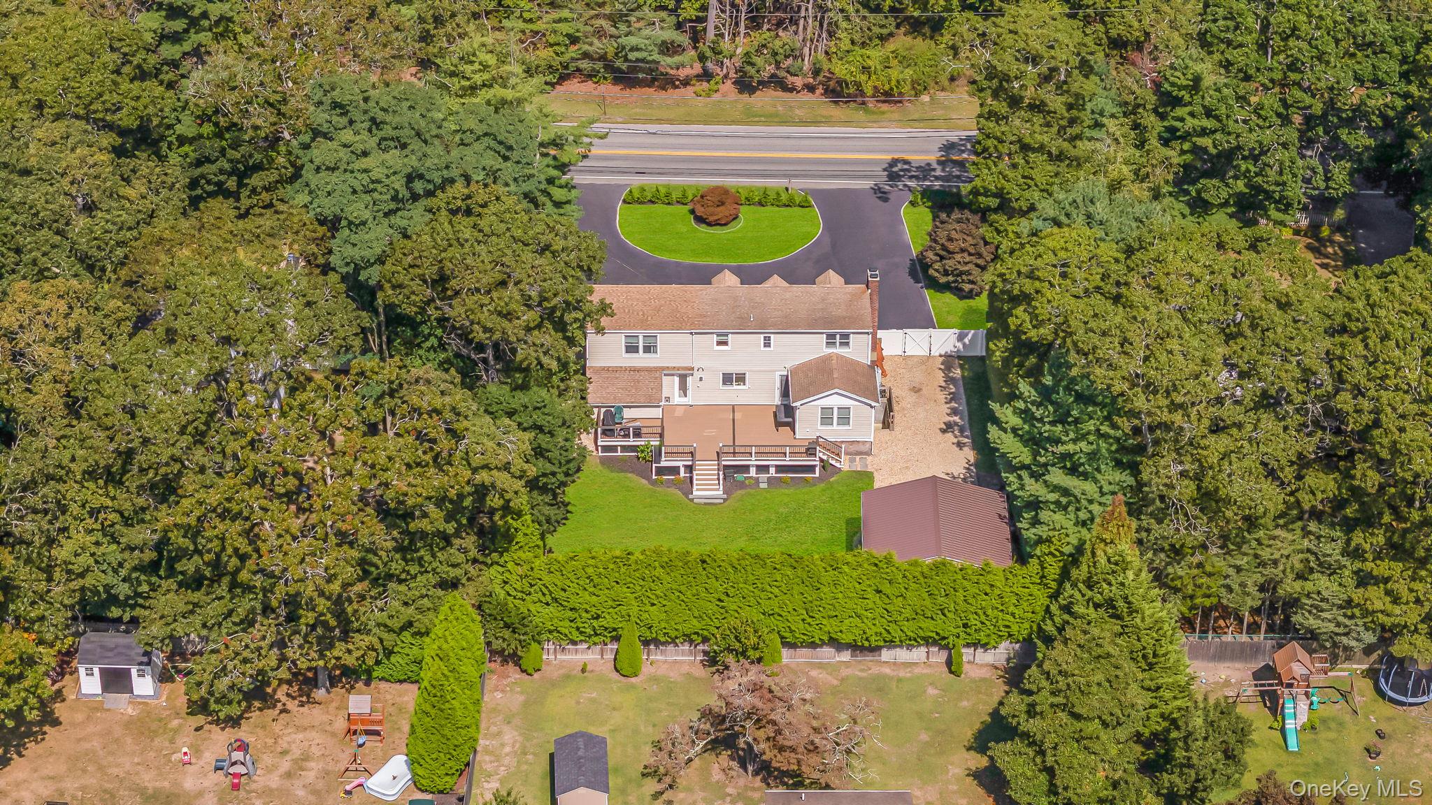 183 Old Country Road Speonk, NY 11972 - Photo 43 of 48 Drone / aerial view of a tree filled landscape