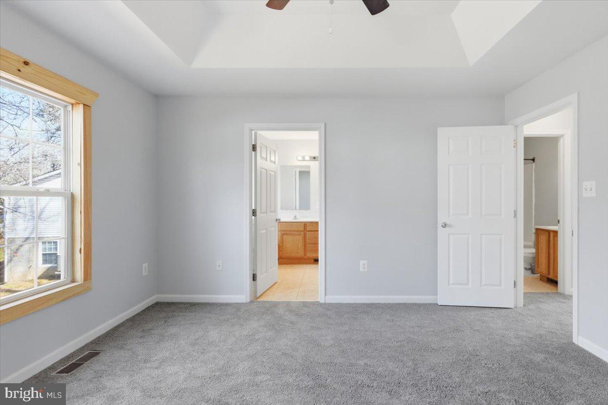 11585 Big Sandy Road Lusby, MD 20657 - Photo 17 of 48 an empty room with windows and closet