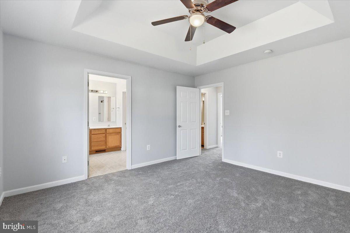 11585 Big Sandy Road Lusby, MD 20657 - Photo 20 of 48 an empty room with closet and a ceiling fan