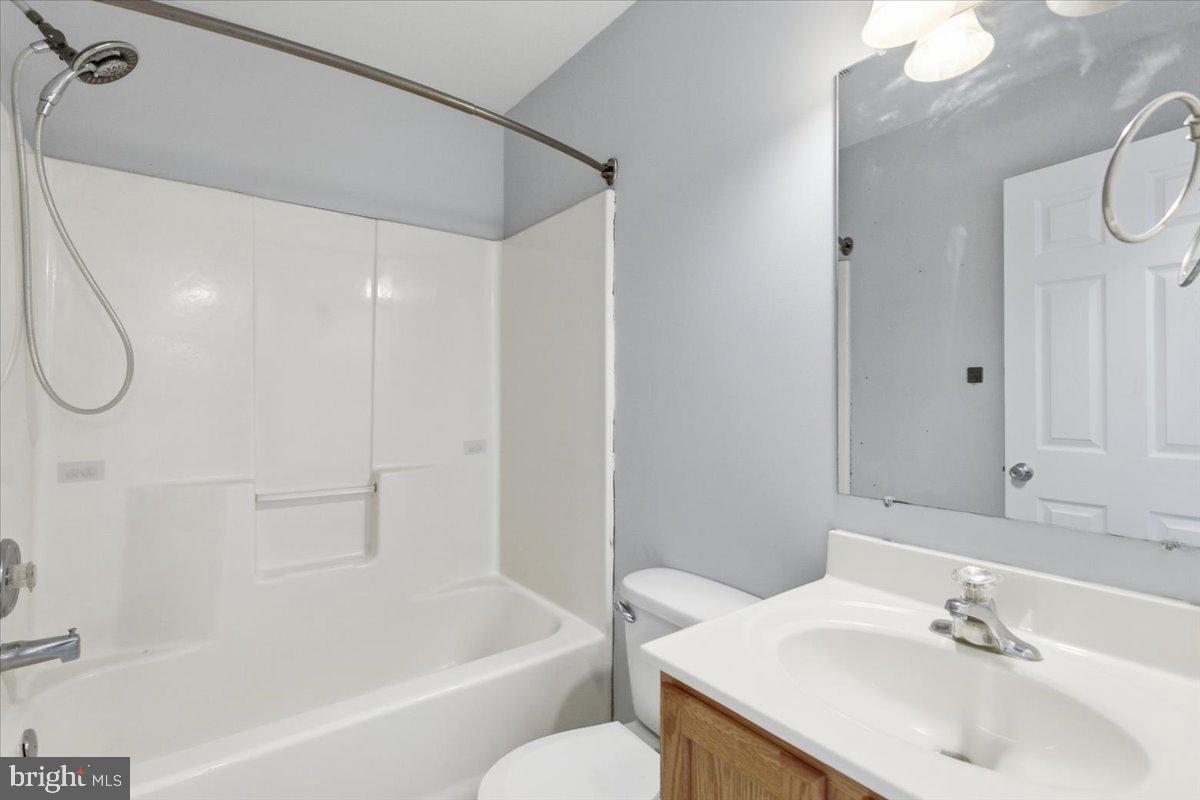 11585 Big Sandy Road Lusby, MD 20657 - Photo 27 of 48 a bathroom with a sink a toilet and shower