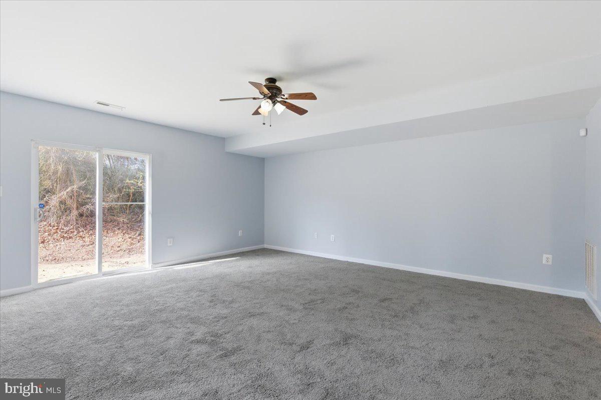 11585 Big Sandy Road Lusby, MD 20657 - Photo 32 of 48 a view of an empty room with a window