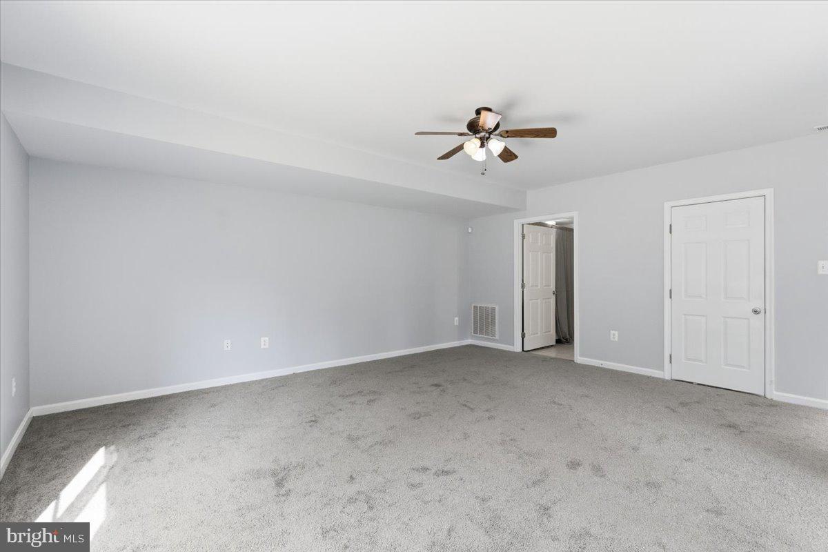 11585 Big Sandy Road Lusby, MD 20657 - Photo 36 of 48 a view of room with a ceiling fan