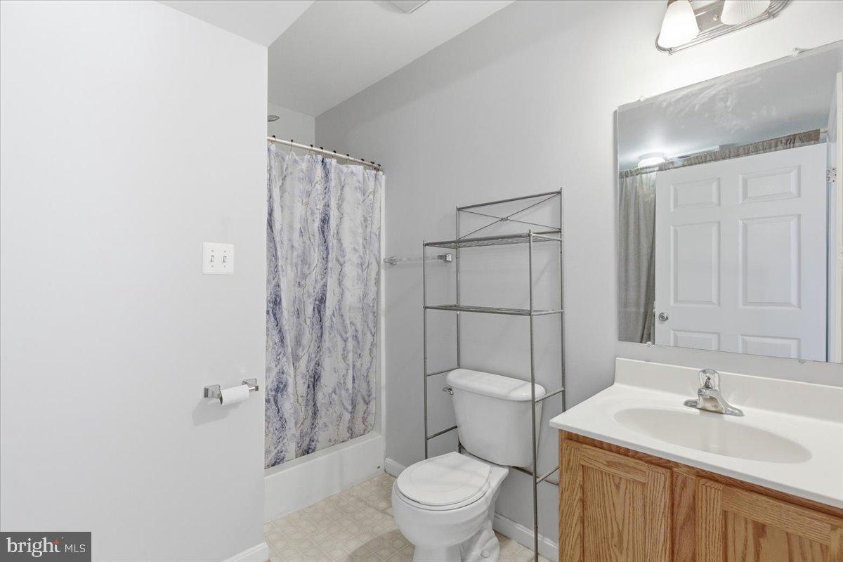 11585 Big Sandy Road Lusby, MD 20657 - Photo 39 of 48 a bathroom with a sink a toilet and shower