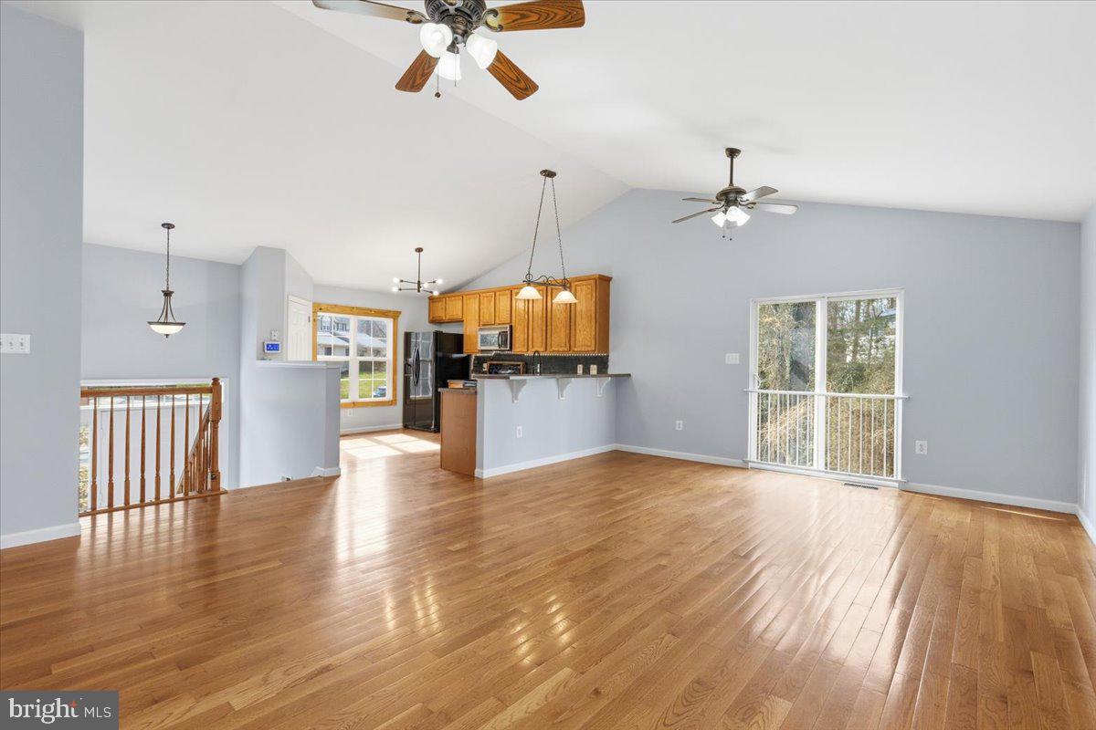 11585 Big Sandy Road Lusby, MD 20657 - Photo 10 of 48 a view of a livingroom with a furniture wooden floor and chandelier