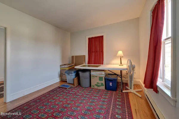 a view of living room with furniture and window