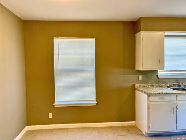a view of a kitchen with a sink