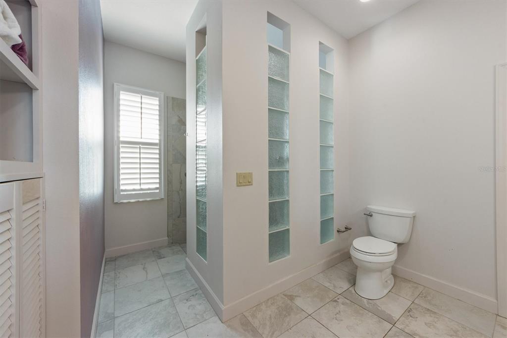 3310 Twin Rivers Trail Parrish, FL 34219 - Photo 24 of 42 a bathroom with a toilet and a shower