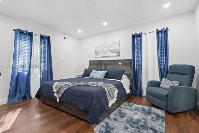 a bedroom with bed and window