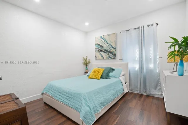 a bedroom with a bed and a table