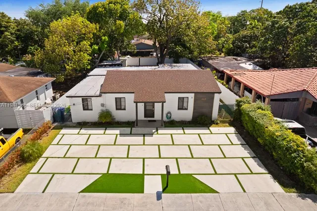 a aerial view of a house with a yard