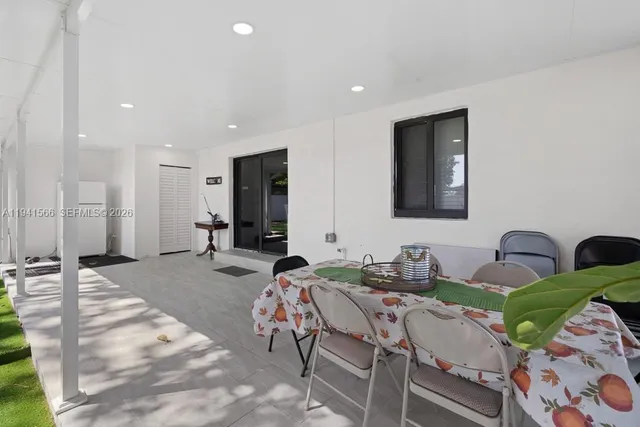 a very nice looking dining room with a table and chairs