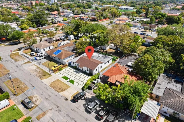 an aerial view of residential houses with outdoor space