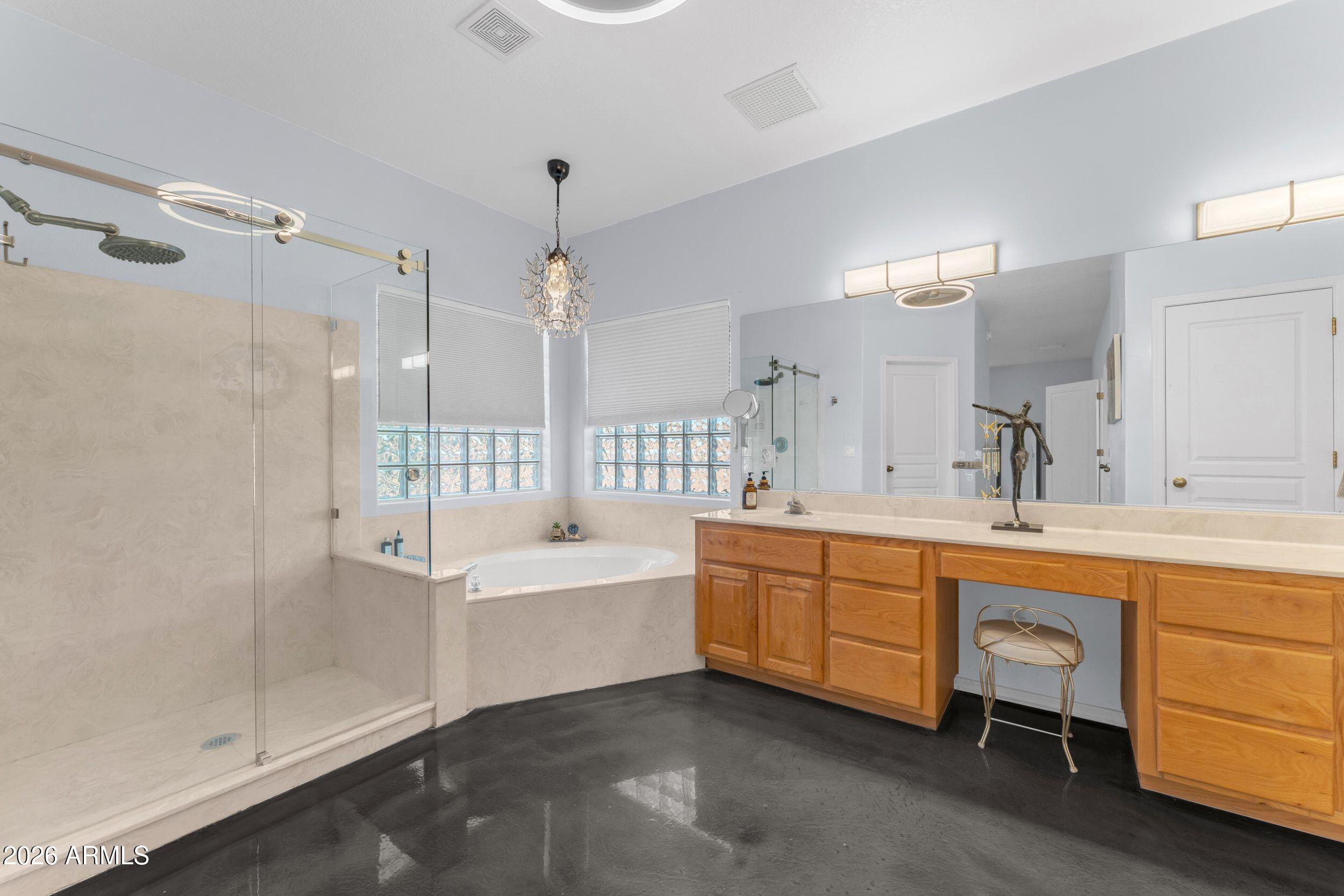 4284 North Colt Road Apache Junction, AZ 85119 - Photo 47 of 92 a large spacious bathroom with a double vanity sink a mirror and a bathtub