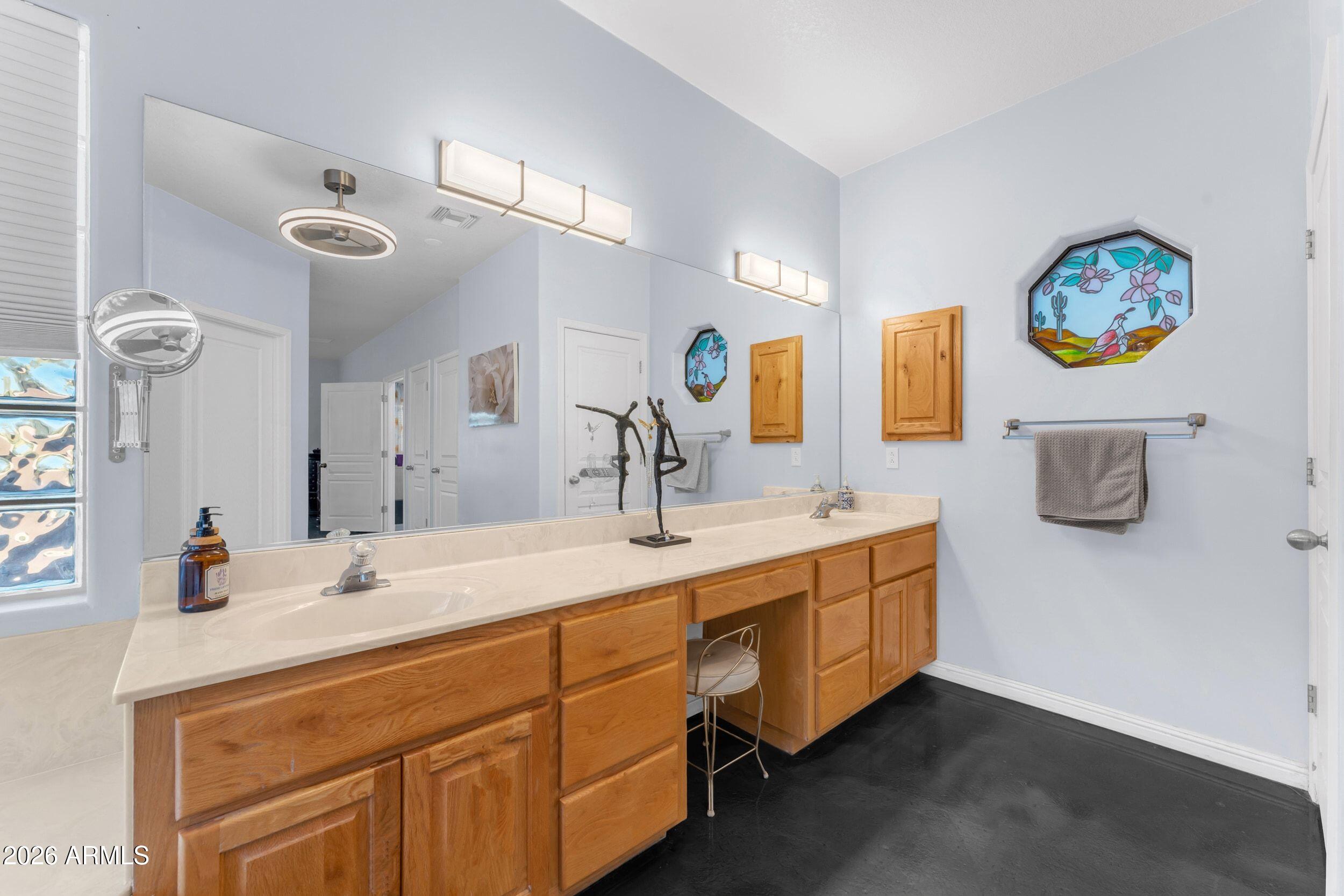 4284 North Colt Road Apache Junction, AZ 85119 - Photo 48 of 92 a bathroom with a double vanity sink and a mirror