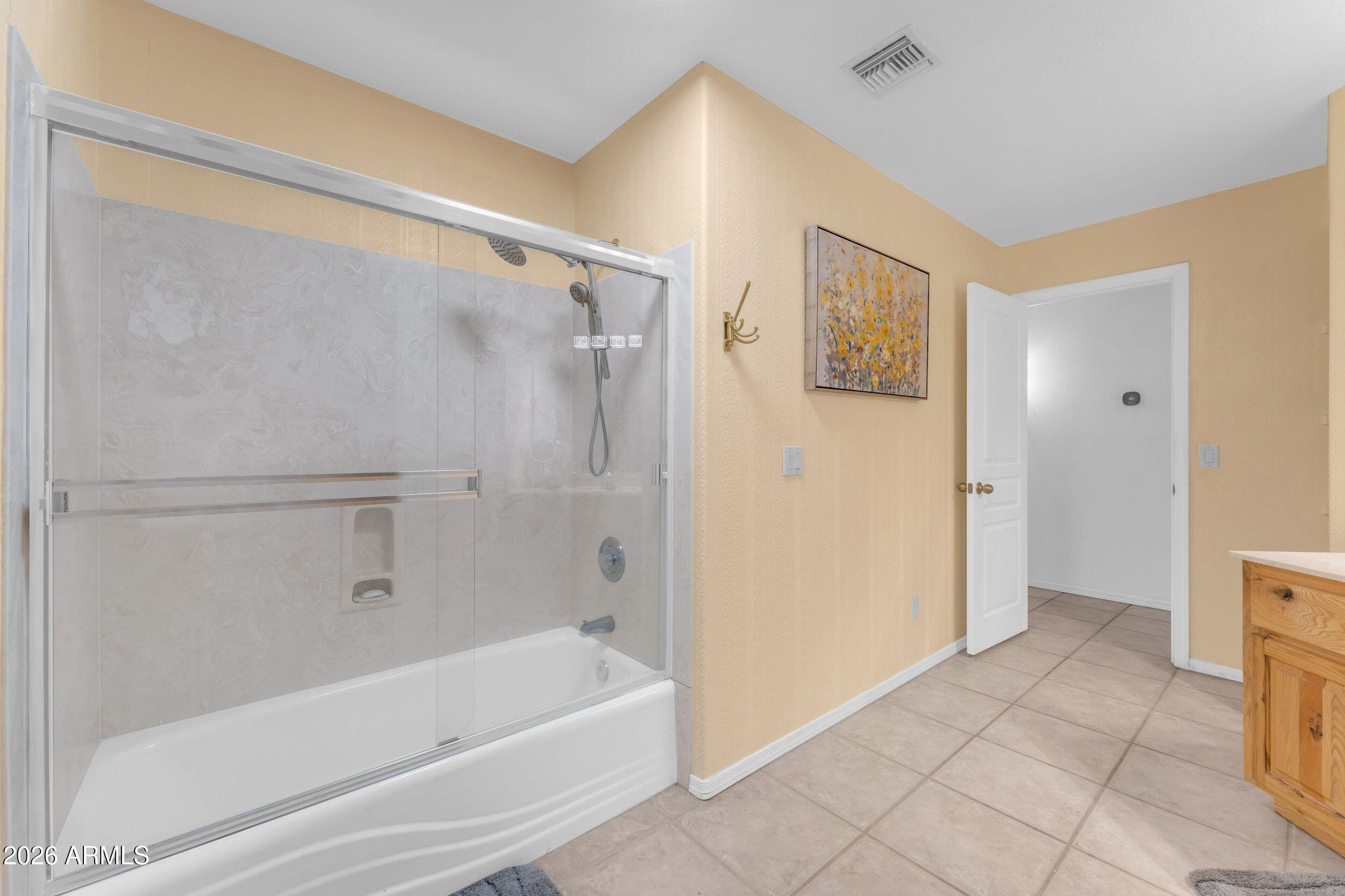 4284 North Colt Road Apache Junction, AZ 85119 - Photo 53 of 92 a bathroom with a bathtub and a shower