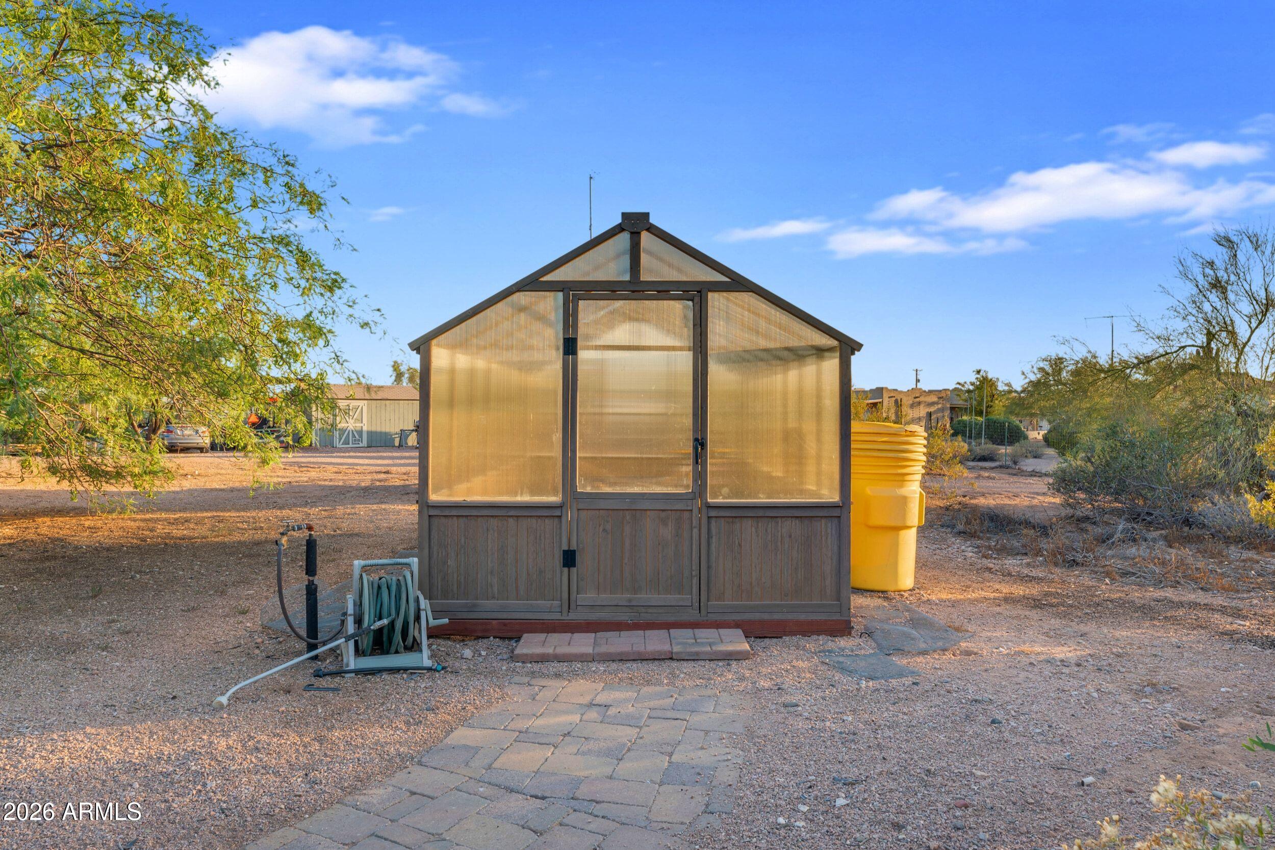 4284 North Colt Road Apache Junction, AZ 85119 - Photo 71 of 92 a view of backyard with tree and wooden fence
