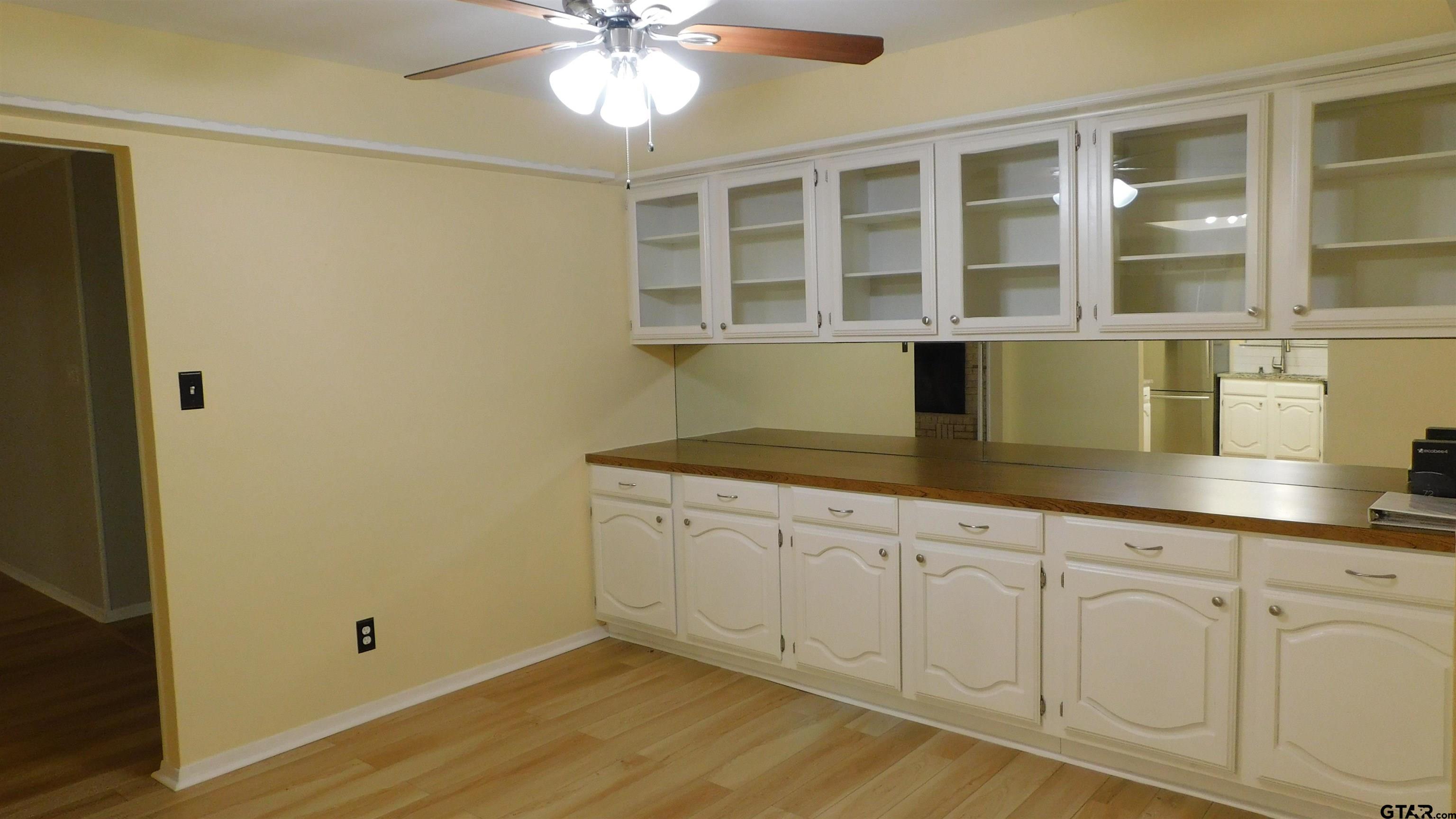 1360 Bridle Path Lane Hideaway, TX 75771 - Photo 7 of 16 a kitchen with a sink and cabinets