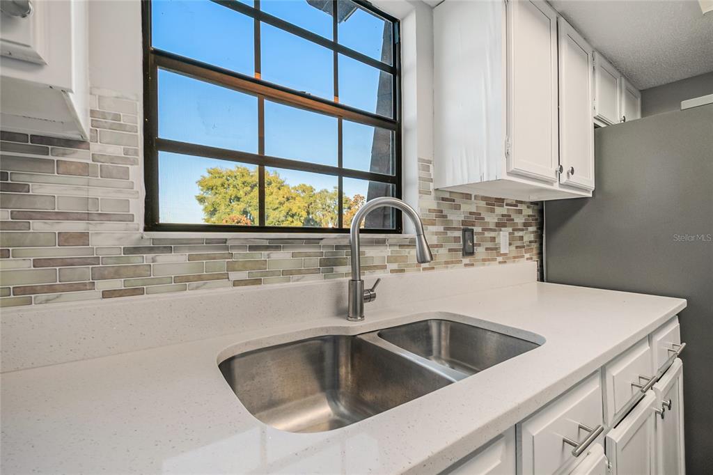 500 Newell Hill Road, Unit 106D Leesburg, FL 34748 - Photo 16 of 45 a close view of sink and tap