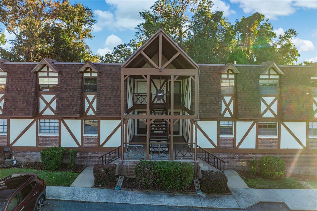500 Newell Hill Road, Unit 106D Leesburg, FL 34748 - Photo 2 of 45 a front view of a house with porch