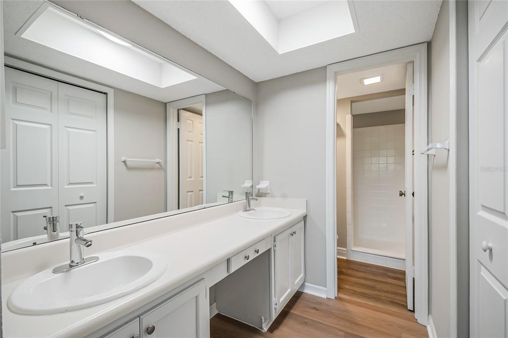 500 Newell Hill Road, Unit 106D Leesburg, FL 34748 - Photo 21 of 45 a bathroom with a sink double vanity and a mirror