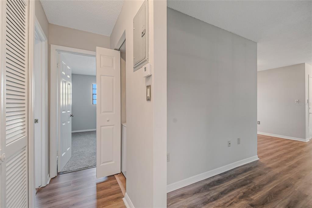 500 Newell Hill Road, Unit 106D Leesburg, FL 34748 - Photo 27 of 45 a view of a hallway with wooden floor