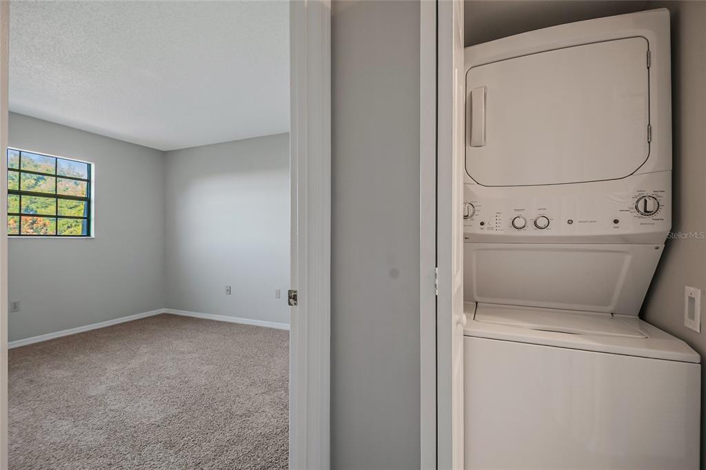500 Newell Hill Road, Unit 106D Leesburg, FL 34748 - Photo 29 of 45 a utility room with dryer and washer