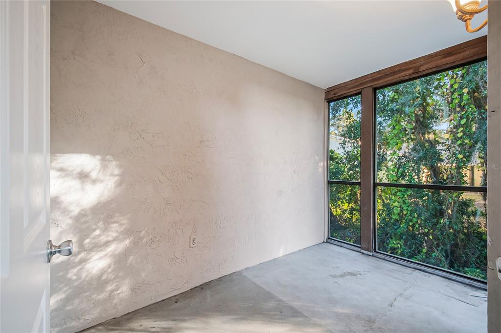 500 Newell Hill Road, Unit 106D Leesburg, FL 34748 - Photo 32 of 45 a view of a big room with windows