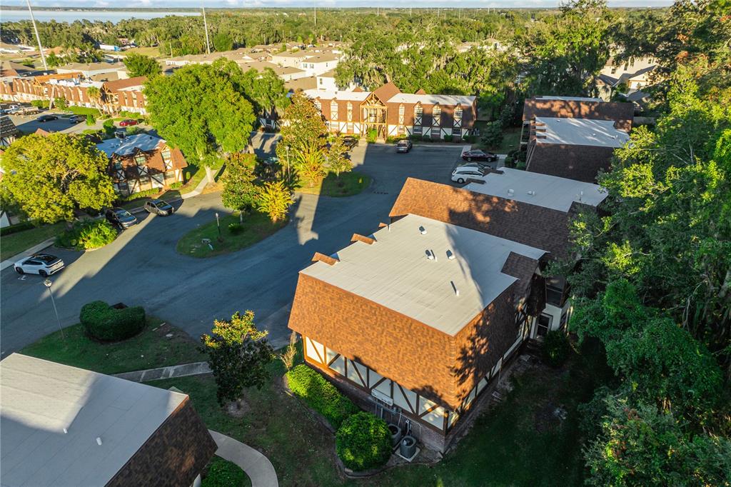 500 Newell Hill Road, Unit 106D Leesburg, FL 34748 - Photo 38 of 45 an aerial view of a house with a yard and lake view