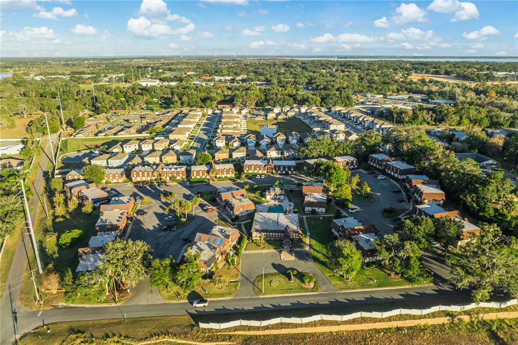 500 Newell Hill Road, Unit 106D Leesburg, FL 34748 - Photo 44 of 45 an aerial view of residential houses with outdoor space