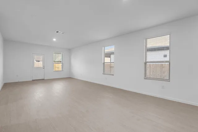 a view of empty room with windows