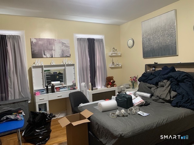 426 Union Avenue, Unit 2 Bridgeport, CT 06607 - Photo 12 of 19 a living room with furniture kitchen view and a fireplace
