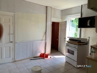 426 Union Avenue, Unit 2 Bridgeport, CT 06607 - Photo 15 of 19 a kitchen with stainless steel appliances a stove a microwave and a refrigerator