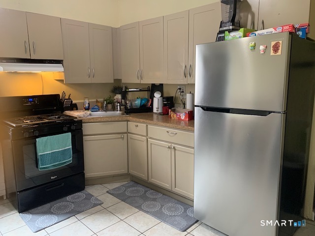 426 Union Avenue, Unit 2 Bridgeport, CT 06607 - Photo 2 of 19 a white refrigerator freezer sitting in a kitchen