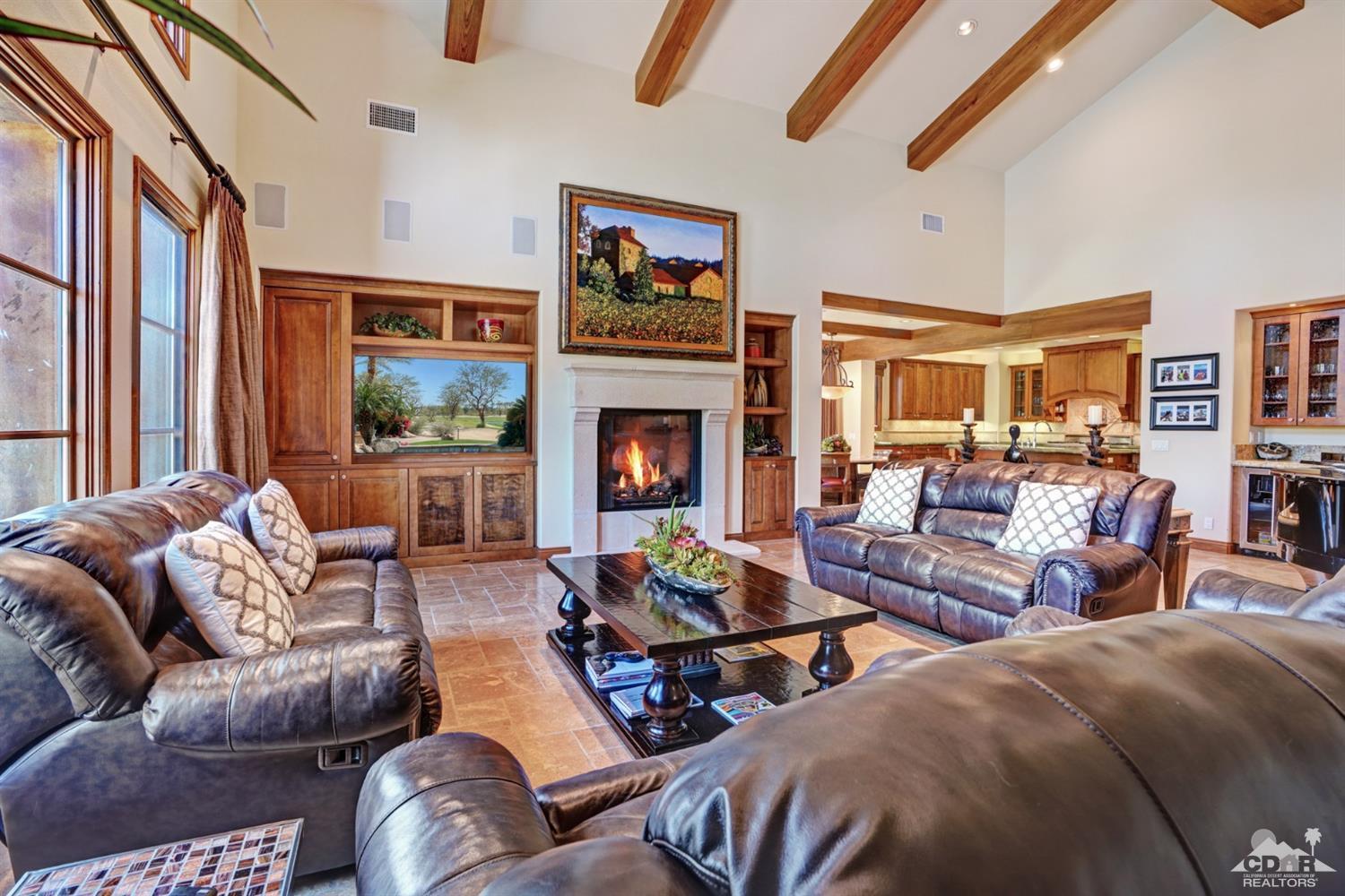 41 Cassis Circle Rancho Mirage, CA 92270 - Photo 2 of 68 a living room with furniture fireplace and a large window