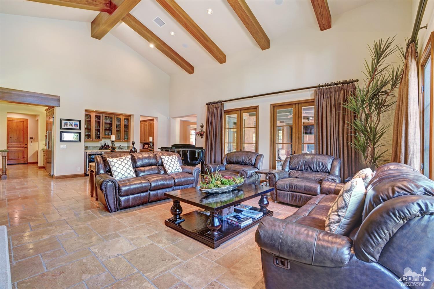 41 Cassis Circle Rancho Mirage, CA 92270 - Photo 11 of 68 a living room with furniture and a large window