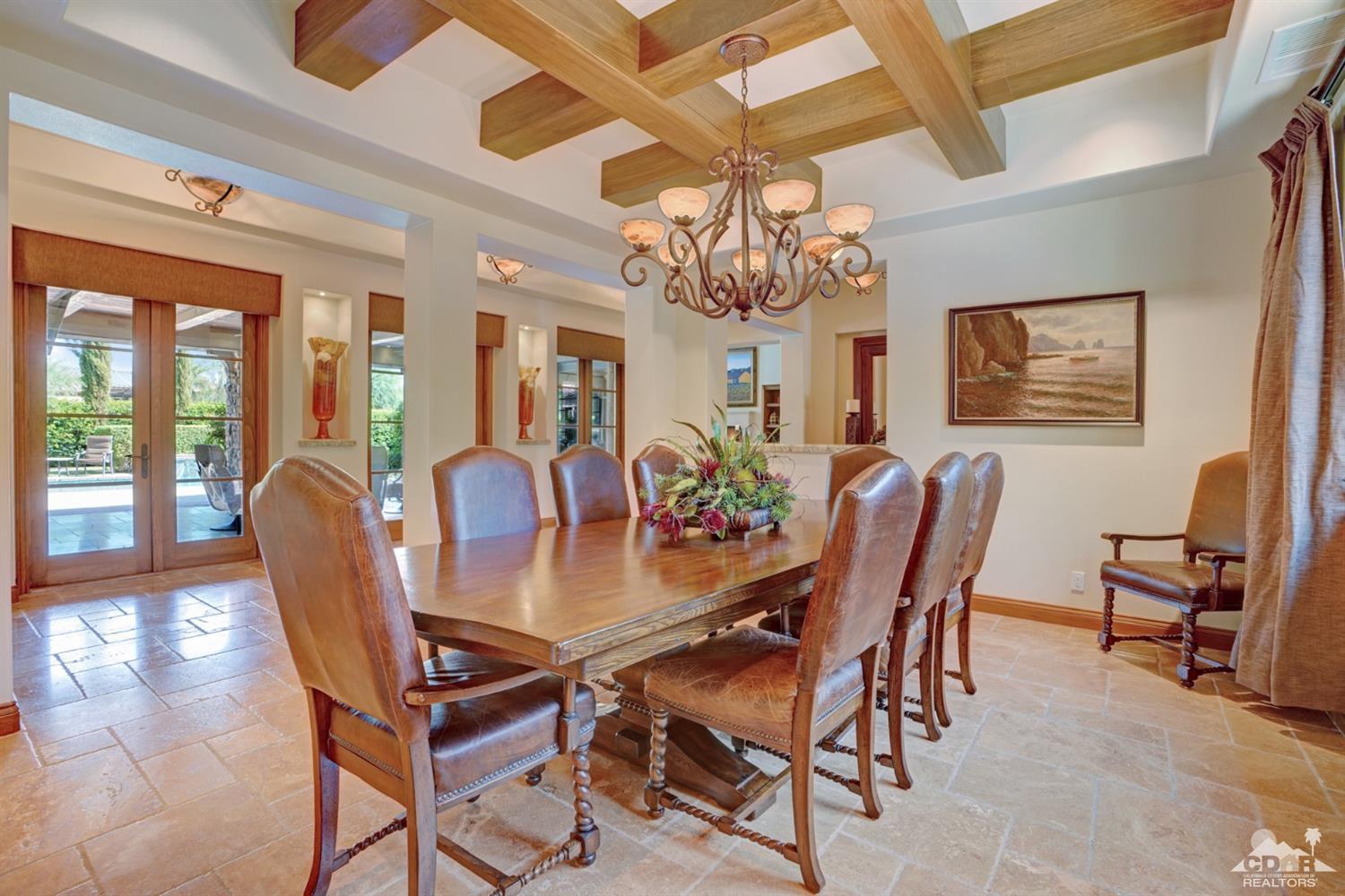 41 Cassis Circle Rancho Mirage, CA 92270 - Photo 21 of 68 a view of a dining room with furniture a chandelier and wooden floor