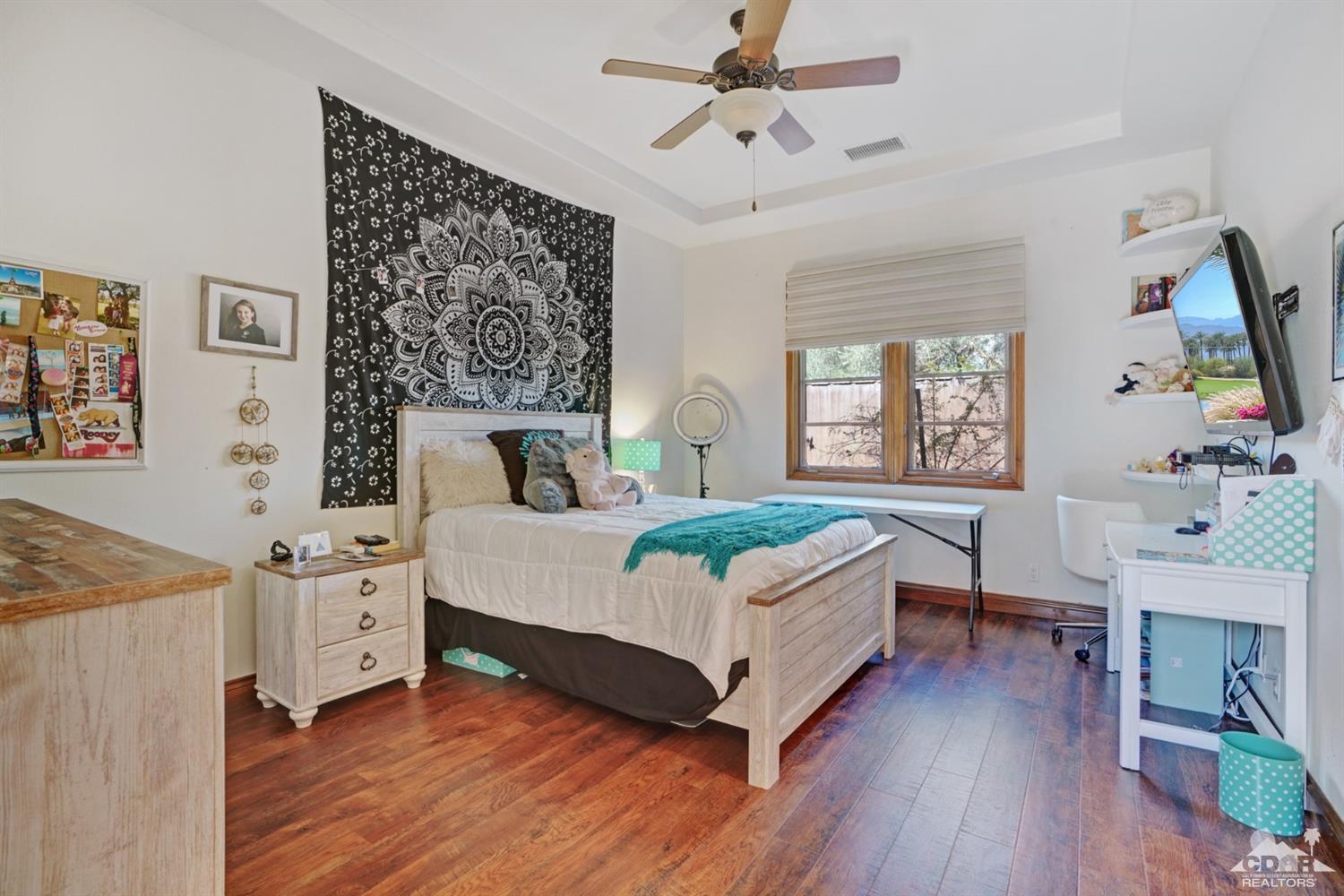 41 Cassis Circle Rancho Mirage, CA 92270 - Photo 29 of 68 a bedroom with a bed and a flat screen tv