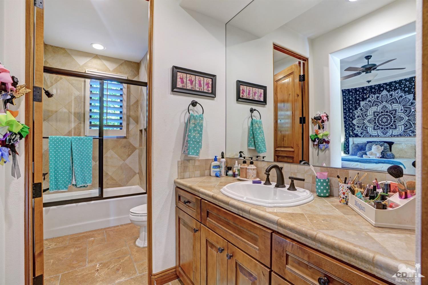 41 Cassis Circle Rancho Mirage, CA 92270 - Photo 30 of 68 a bathroom with a double vanity sink mirror and shower