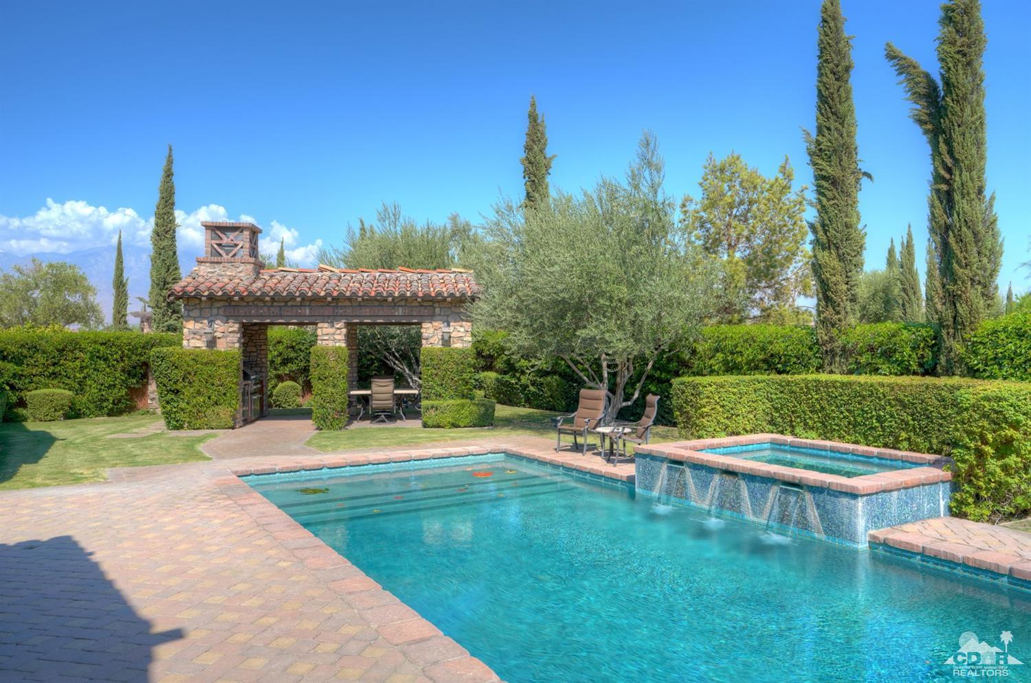 41 Cassis Circle Rancho Mirage, CA 92270 - Photo 38 of 68 a view of a house with a yard table and chairs