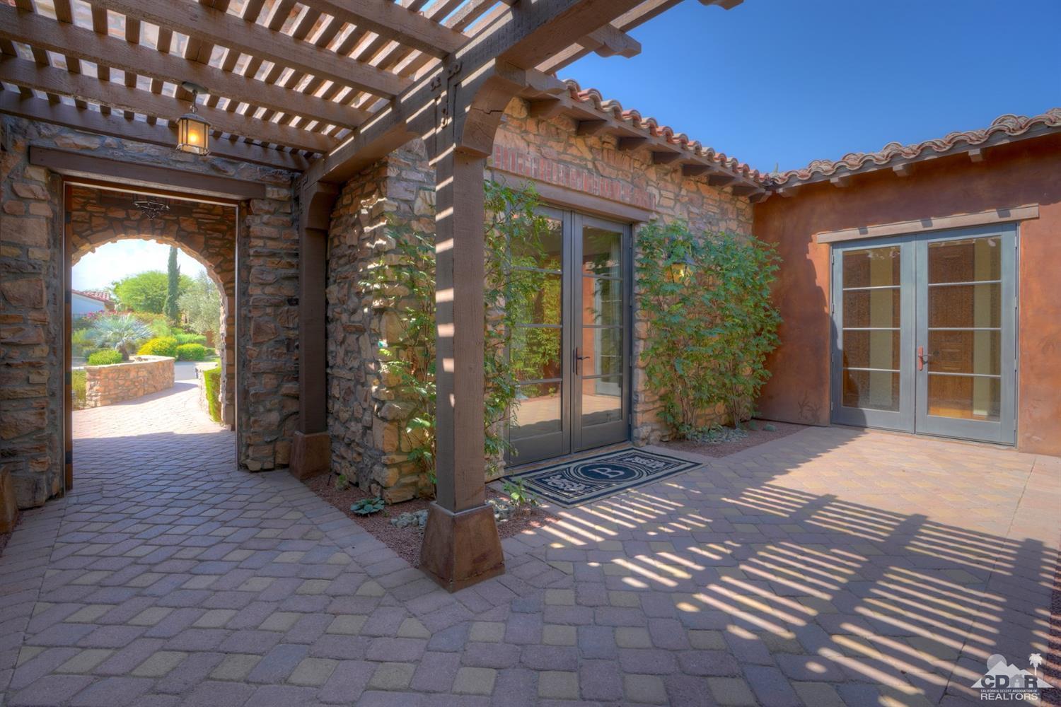 41 Cassis Circle Rancho Mirage, CA 92270 - Photo 5 of 68 a view of a porch with a table and chairs