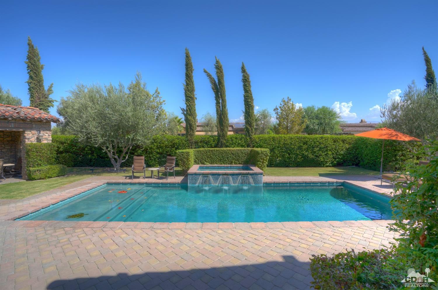 41 Cassis Circle Rancho Mirage, CA 92270 - Photo 45 of 68 a view of a swimming pool with a yard and plants