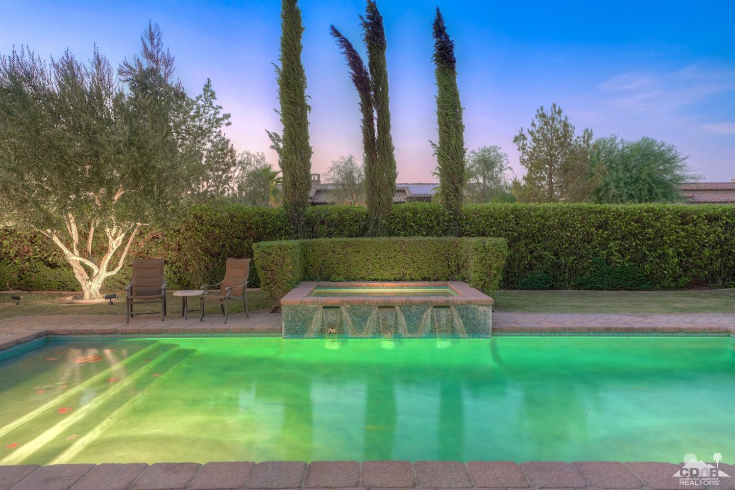 41 Cassis Circle Rancho Mirage, CA 92270 - Photo 50 of 68 a view of yard with swimming pool and trees in the background