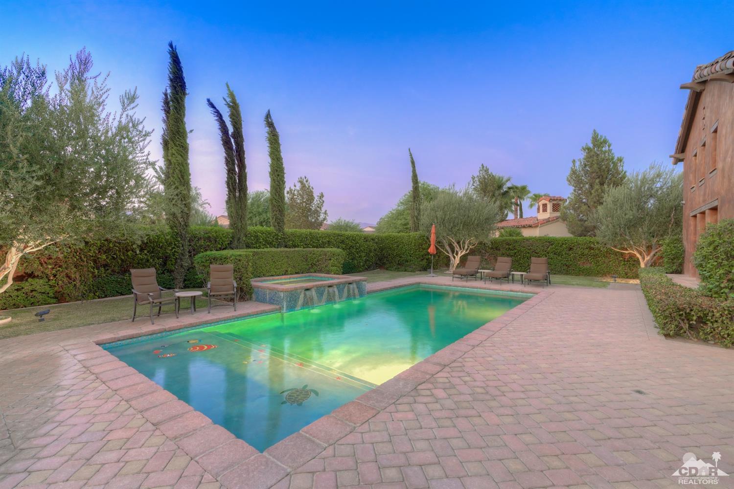41 Cassis Circle Rancho Mirage, CA 92270 - Photo 52 of 68 a view of a swimming pool with a yard