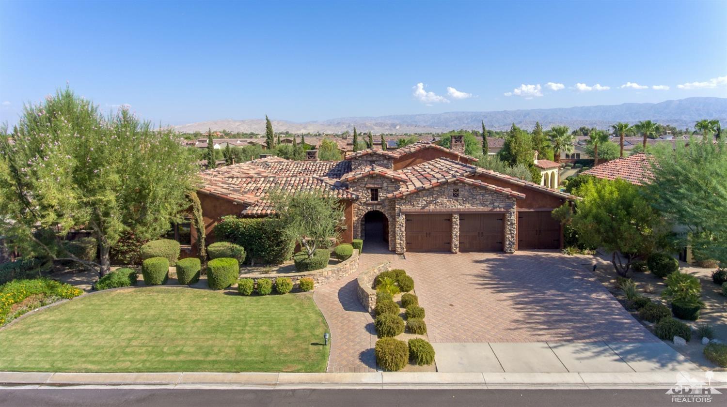 41 Cassis Circle Rancho Mirage, CA 92270 - Photo 66 of 68 a front view of a house with a yard