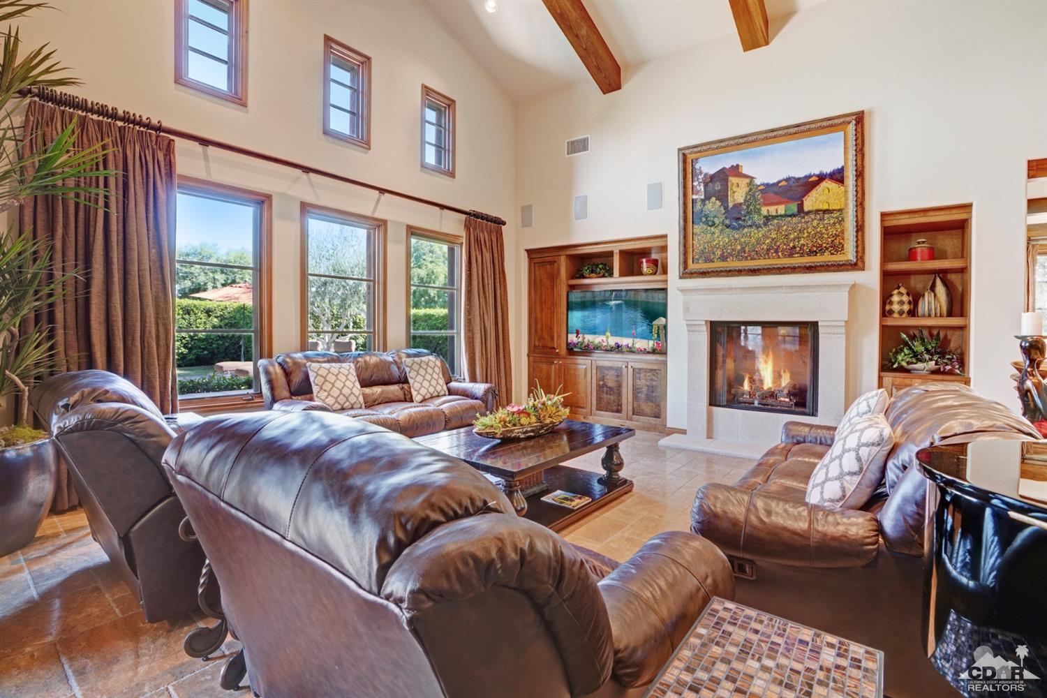41 Cassis Circle Rancho Mirage, CA 92270 - Photo 10 of 68 a living room with furniture large window and fireplace