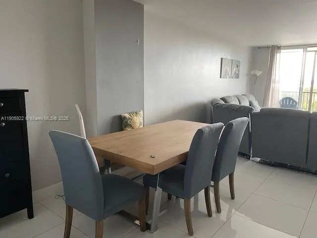 a kitchen with a refrigerator and a stove