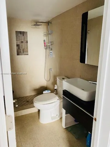 a room with gym equipment and a large window