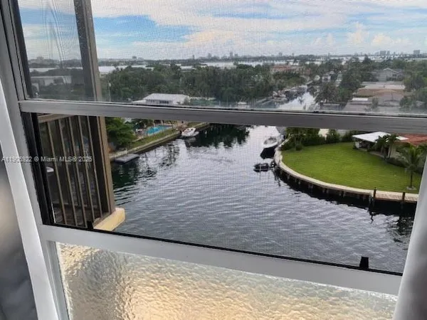 a view of a swimming pool with a lake view and mountain view