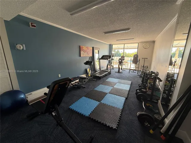 a kitchen with a stove a refrigerator and a microwave