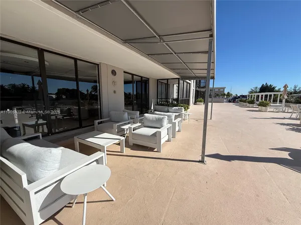 a view of a house with outdoor space and sitting area